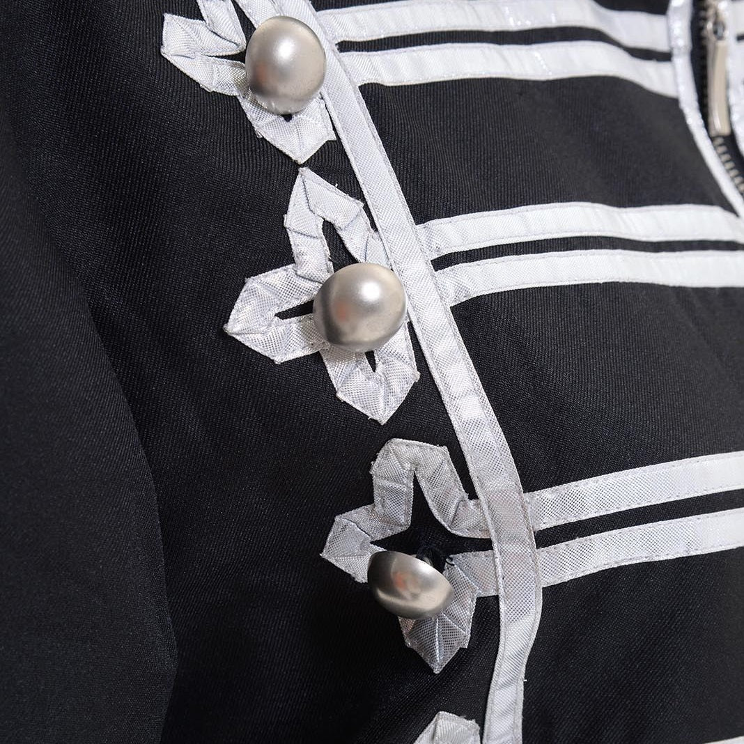 Close-up of silver band-style trim and button details on MCR jacket